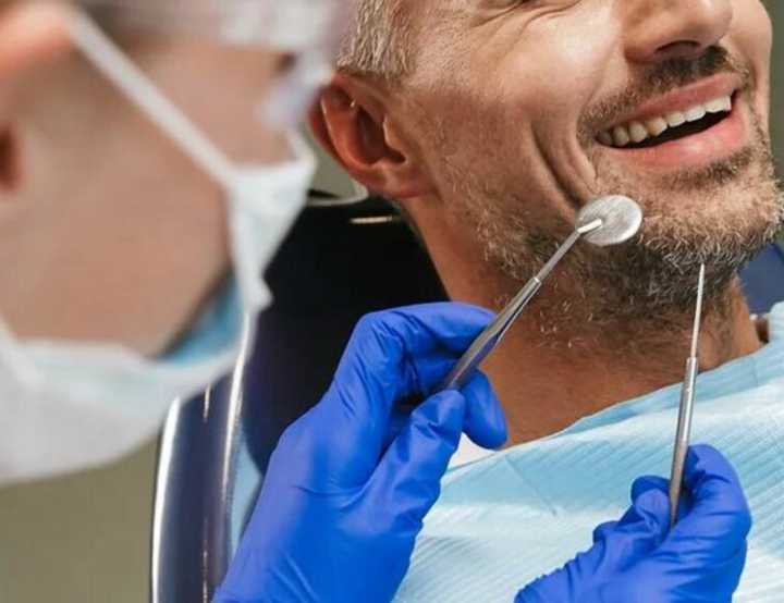 Patient being examined by dentist