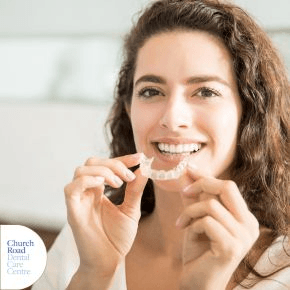 Woman putting in aligners